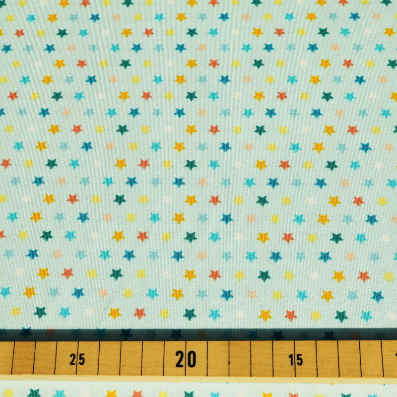 Jersey Stoff bunte Sterne hellblau